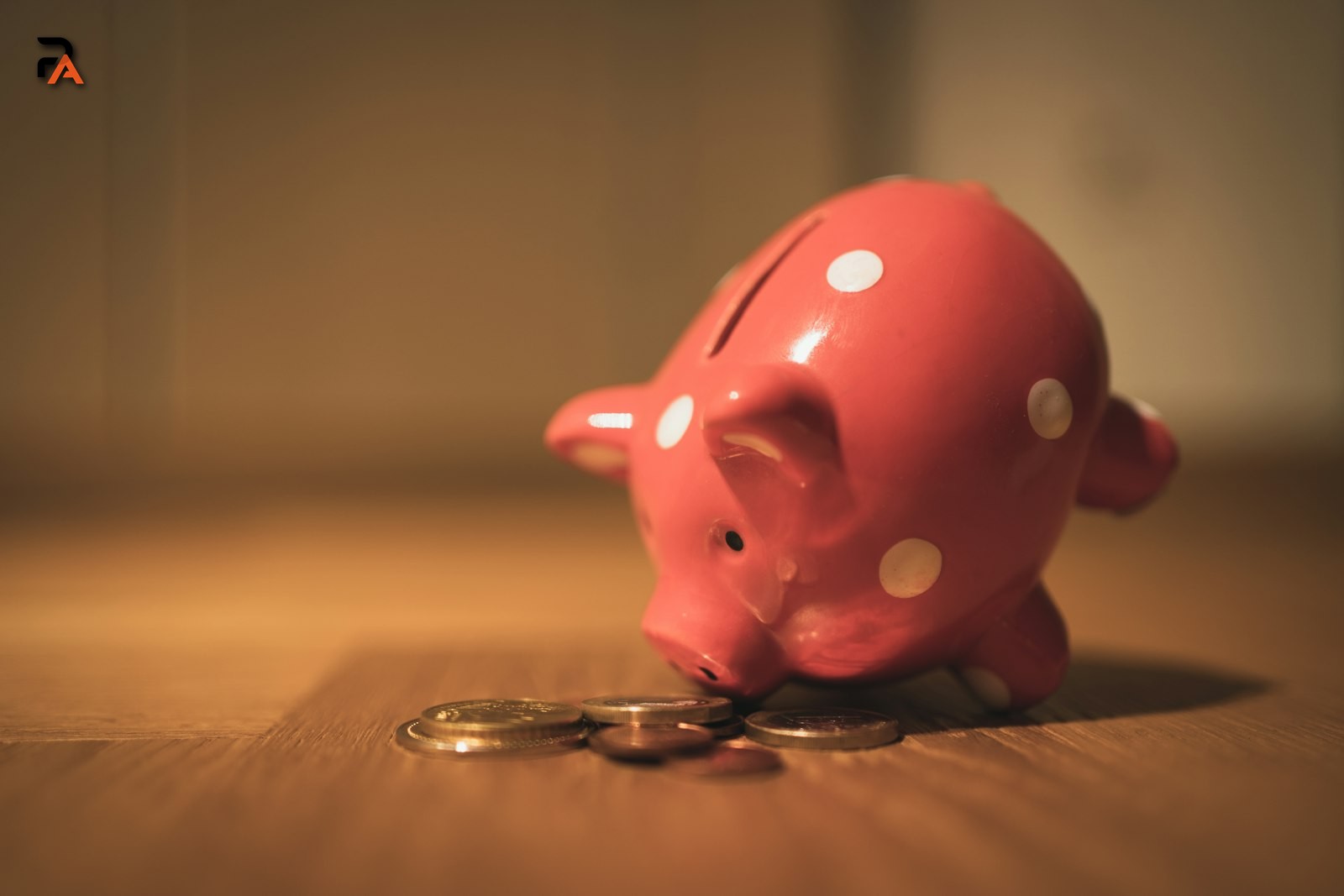 A piggy bank with coins, representing how savings grow through compound interest