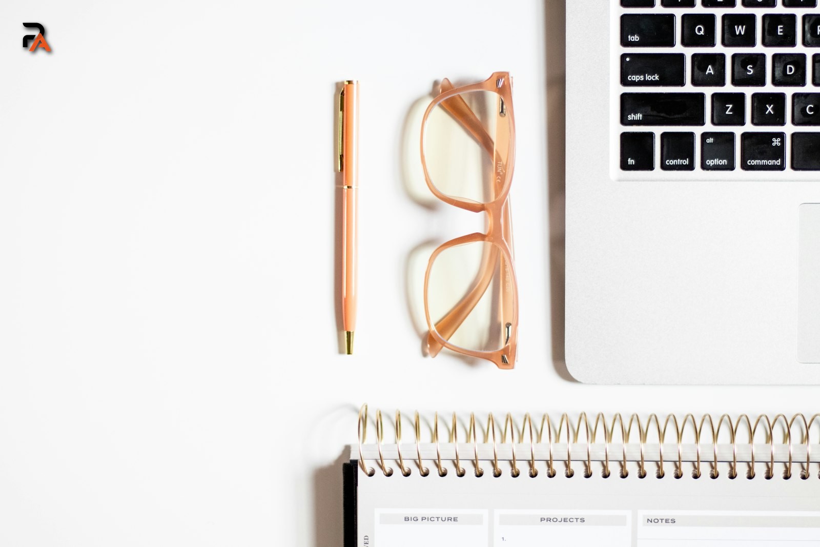 A clean study desk with a notebook, pen, and glasses, set up for practice